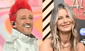 Agnieszka Wiśniewska i jej mąż, wokalista z charakterystyczną fryzurą, uśmiechają się do obiektywu.