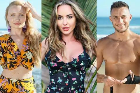 Trójka uczestników Hotel Paradise 2: blondynka w pomarańczowym stroju, brunetka w kwiecistej sukience i mężczyzna z opaską na ręce na tle plaży.