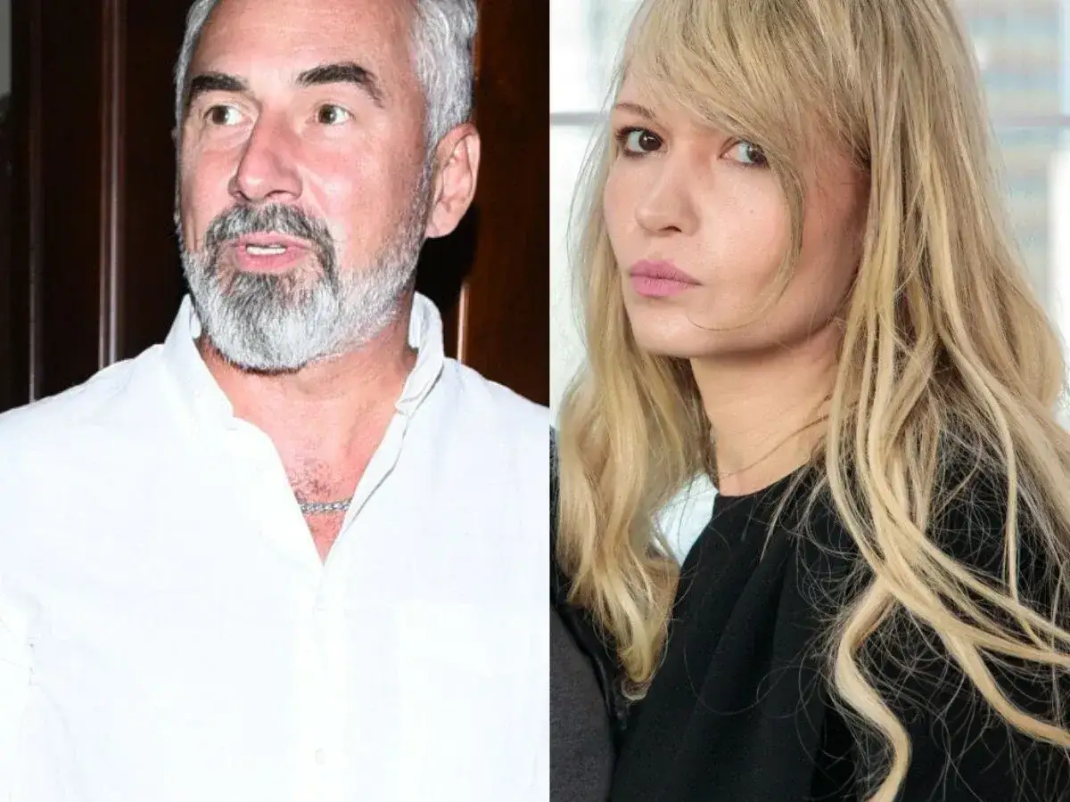 Jacek Kopczyński z żoną, uśmiechnięty mężczyzna z siwą brodą i młoda blondynka o delikatnych rysach.