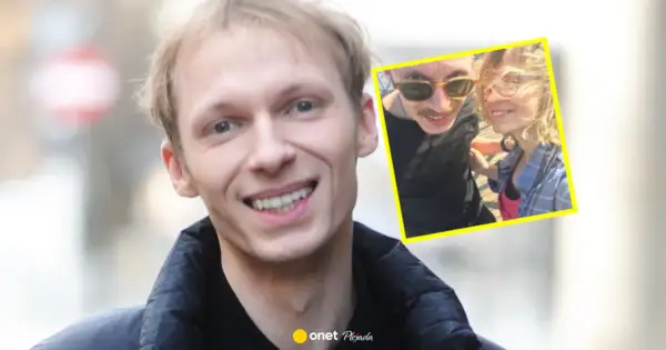 Igor Herbut z żoną na zdjęciu. Uśmiechnięty wokalista i jego ukochana w słoneczny dzień.